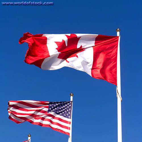 Stock Photo titled: Canadian And American Flag Toronto Ontario Canada, USE OF THIS IMAGE WITHOUT PERMISSION IS PROHIBITED
