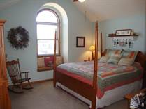 Master features cathedral ceiling & arched window with built in bench