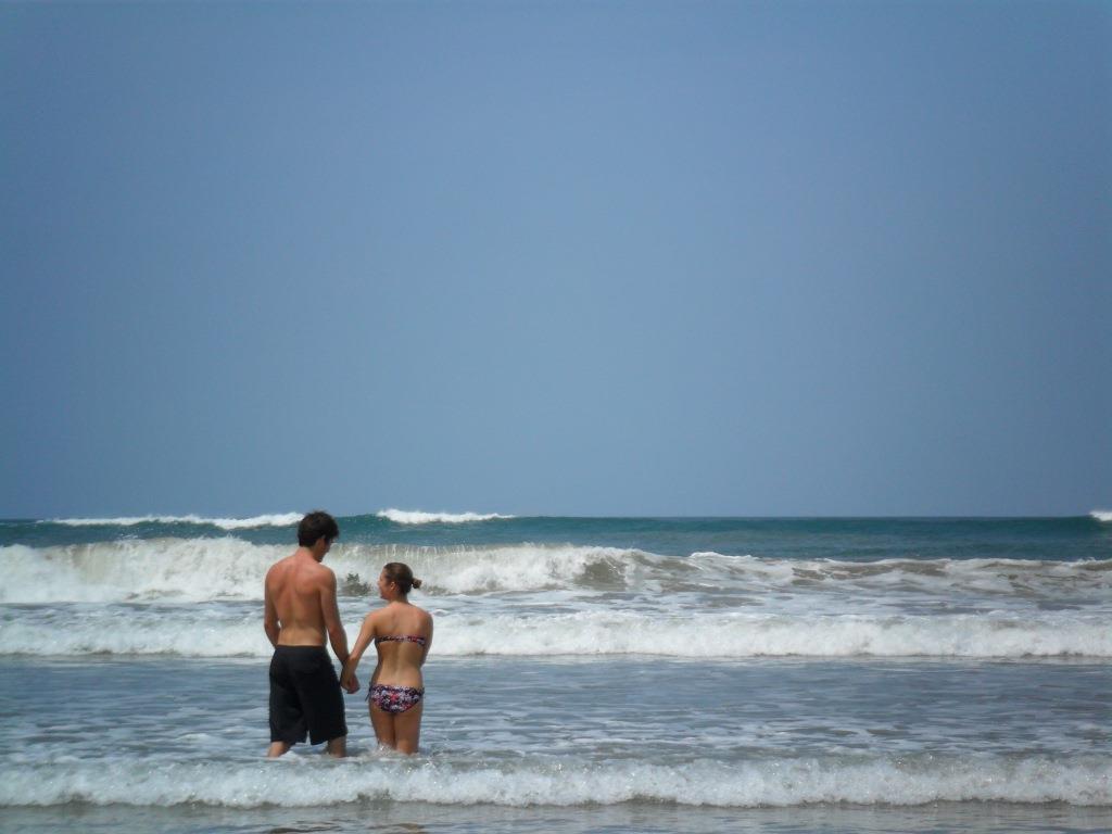 couple swimming  in  Tamarindo Costa Rica