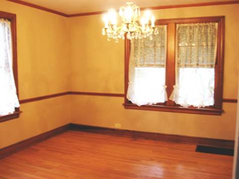 Formal Dining Room with Chair Rail and Hardwood Floors