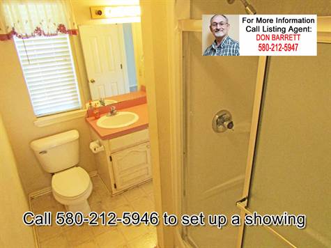 Third Bathrom.  Accessible from the office (could be a fourth bedroom), and accessible from the kitchen/laundry area.