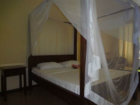 The bedroom Bed for the Diani Beach Cottages for self catering