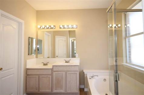 Master Bath with His & Her Sinks, Beveled Mirror Med Cabinet, Oval Garden Tub, Sep Shower & Huge Walk in closet
