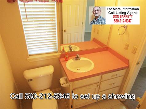 Third Bathrom.  Accessible from the office (could be a fourth bedroom), and accessible from the kitchen/laundry area.