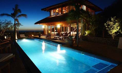 Night Time View Of Villa from Pool