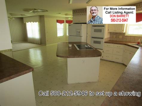 Spacious Great Room combining kitchen, dining room, breakfast nook, and an additional dining space. 308 W Fisher Ln, Idabel OK 74745 10 acres home for sale.