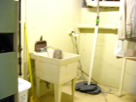 UNFINISHED BASEMENT EVEN HAS ITS OWN UTILITY TUB & SUMP PUMP