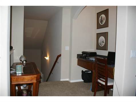 Upstairs is like a second living area with a desk area, 4th bedr