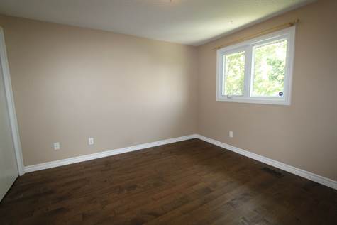 Spacious secondary bedrooms with new hardwood flooring.
