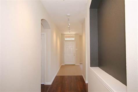 Entry & Foyer with Art Niche, Ceiling Halogen Track Lighting, Wood Plank Laminate &18 inch Ceramic Tile Flooring