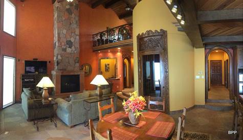 Great Room with Stone fireplace and wine cellar
