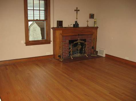  Living Room with Hardwood Floors and Woodburning Fireplace