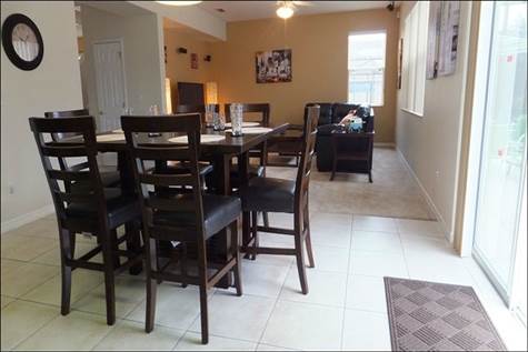 Dining off of kitchen area next to family room